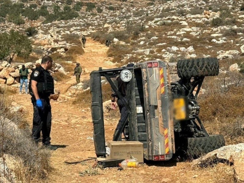 A flipped-over truck that belonged to an Israeli settler targeted in a resistance operation in Al-Mughayir, West Bank, Occupied Palestine, August 21, 2025 (social media)