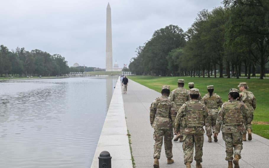 District of Columbia National Guard soldiers walk along the National Mall in Washington on Aug. 18, 2025. (Nina Cortez/U.S. Army)