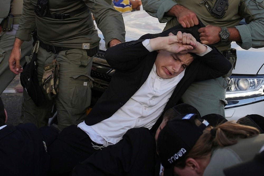 Police disperse Ultra-Orthodox Jews blocking a highway during a protest against army recruitment, in the settlemen of Bnei Brak, occupied Palestine, Tuesday, Aug. 19, 2025. (AP)