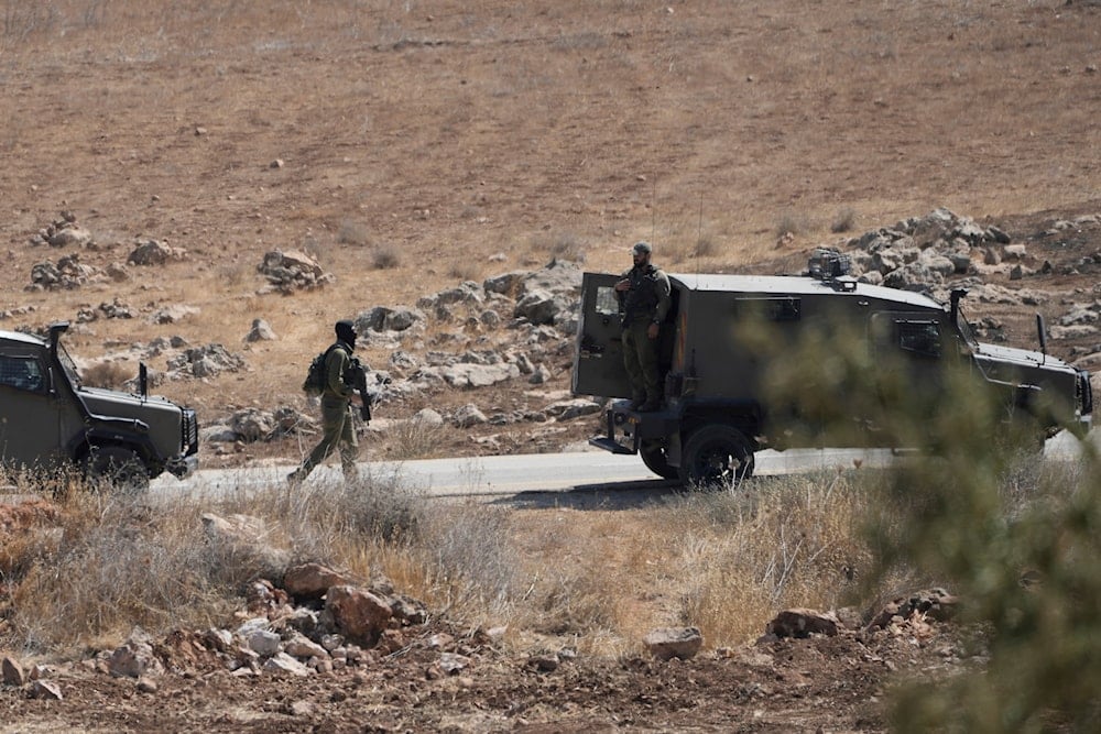 Israeli settlers attack shepherds as IOF raid West Bank