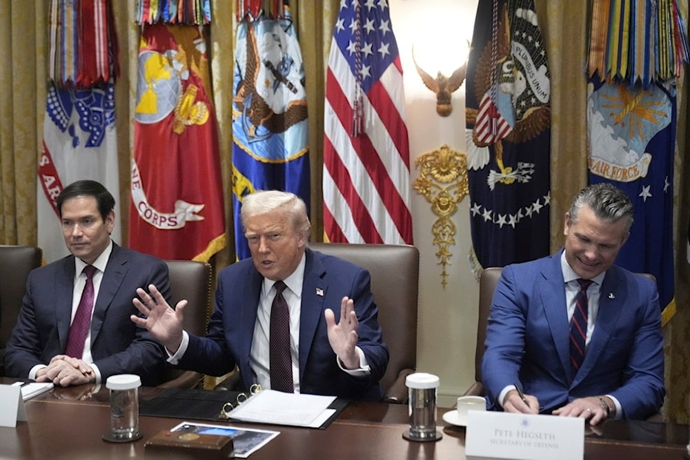 President Donald Trump speaks during a cabinet meeting, Tuesday, Aug. 26, 2025, at the White House in Washington, as Secretary of State Marco Rubio, left, and Secretary of Defense Pete Hegseth look on (AP)