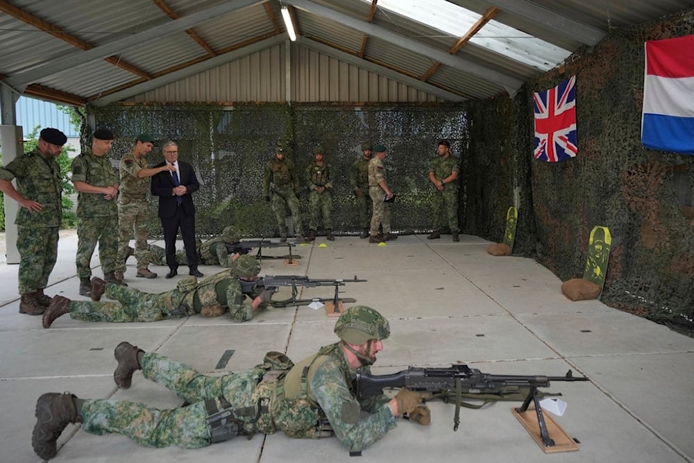 British Prime Minister Keir Starmer watches a demonstration by troops as he visits the Netherlands marines training base, as part of the UK-Netherlands Joint Amphibious Force in Rotterdam, Netherlands, Tuesday, June 24, 2025 (AP)