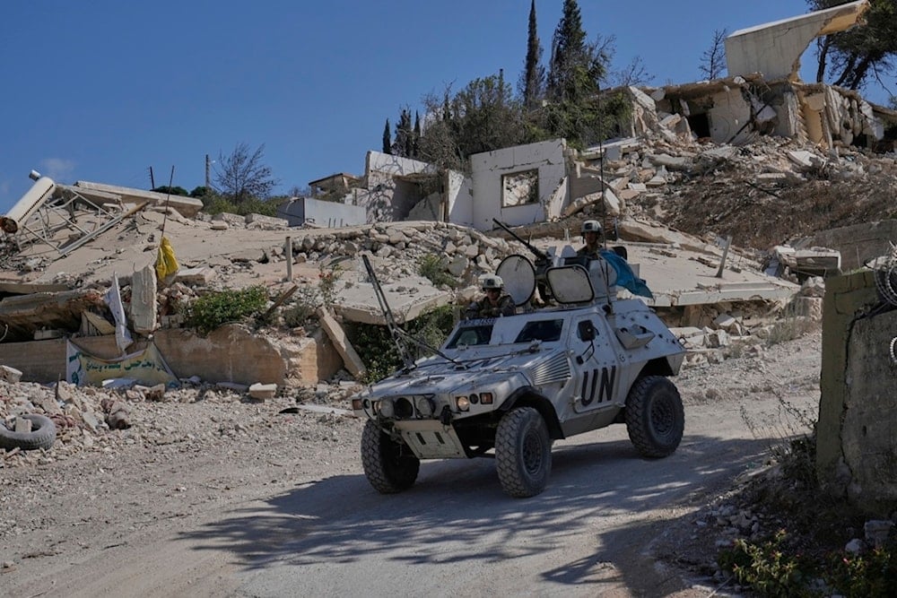 French U.N. peacekeepers patrol the Lebanese-Israeli border in the village of Kfra Kila, southern Lebanon, Wednesday, Aug. 20, 2025. (AP Photo/Hussein Malla)