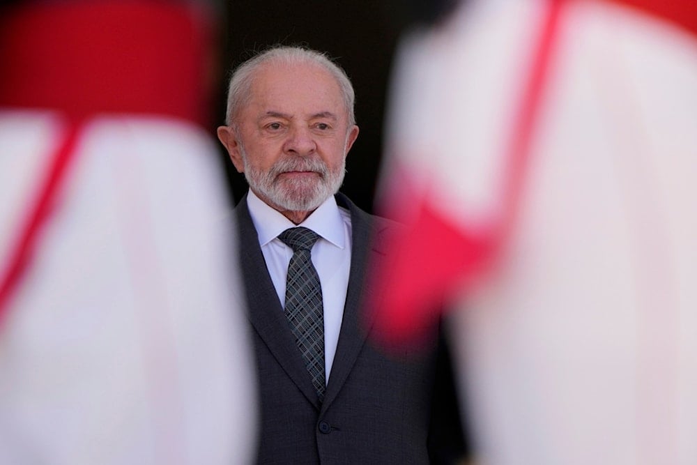 Brazil's President Luiz Inacio Lula da Silva stands at Planalto presidential palace during the arrival of Ecuador's President Daniel Noboa in Brasilia, Brazil, Monday, Aug. 18, 2025. (AP)