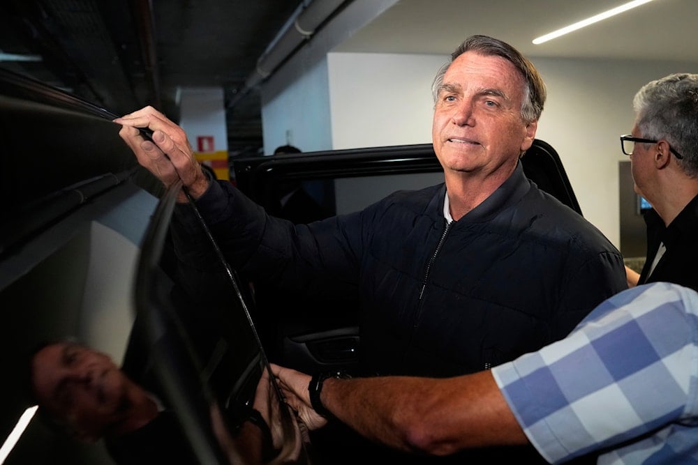 Former President Jair Bolsonaro leaves the Liberal Party headquarters in Brasilia, Brazil, Wednesday, July 23, 2025 (AP)