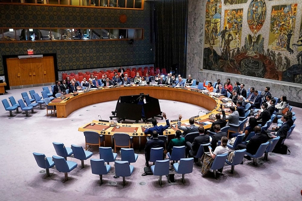The United Nations Security Council votes on a resolution, during a meeting, Monday, June 30, 2025. (AP Photo/Richard Drew)