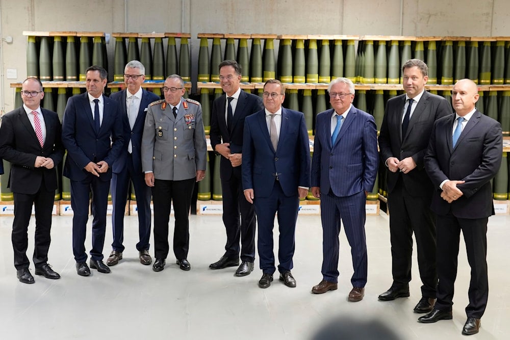 NATO Secretary General Mark Rutte, German Vice Chancellor Lars Klingbeil, German Defense Minister Boris Pistorius, and Rheinmetall CEO Armin Papperger pose in front of artillery shells in Unterleuss, Germany, August 27, 2025 (AP)