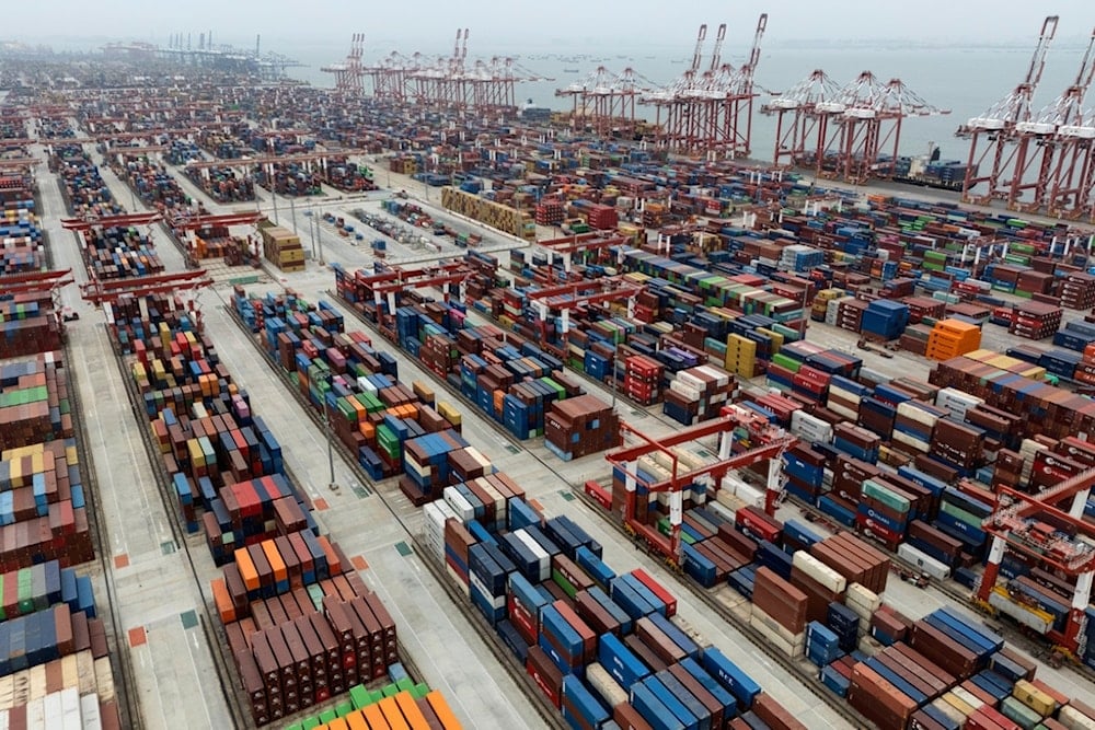 FILE - Shipping containers are seen ready for transport at the Guangzhou Port in the Nansha district in southern China's Guangdong province on Thursday, April 17, 2025. (AP Photo/Ng Han Guan)