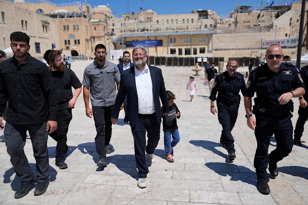  Israeli far-right Police Minister Itamar Ben-Gvir, center, flanked by his security detail, approach al-Aqsa mosque complex, al-Quds, Occupied Palestine, Aug. 13, 2024 (AP)