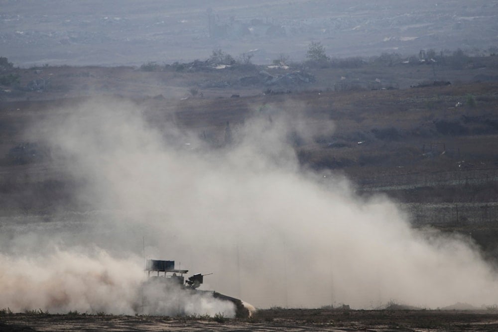 Israeli soldiers drive their armored personnel carrier along the Gaza Strip, in southern occupied Palestine, Wednesday, July 30, 2025 (AP)