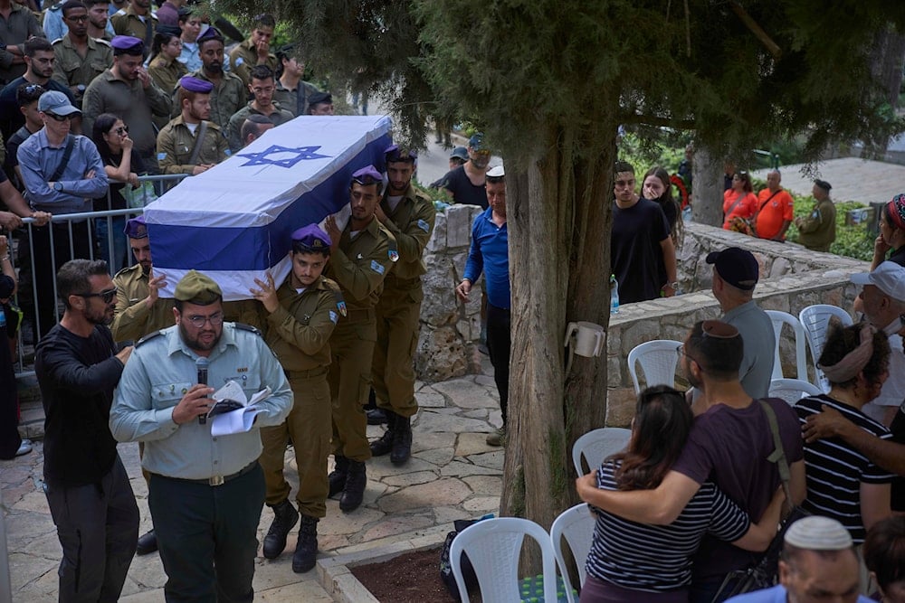 Israeli soldiers carry the flag-draped casket of Sgt. Omer Van Gelder, who was killed in Gaza, in al-Quds, Occupied Palestine, Tuesday, June 3, 2025 (AP)