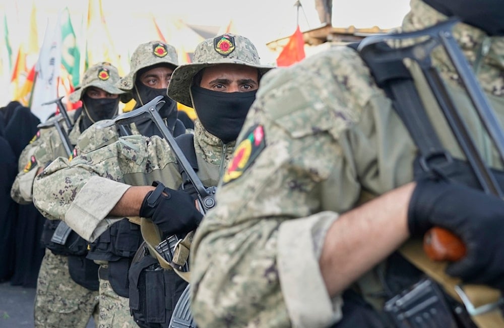 Members from the Popular Mobilization Forces attend the funeral of commander Haider al-Moussawi from Kataeb Sayyed Al-Shuhada in Baghdad, Iraq, Sunday, June 22, 2025 (AP)