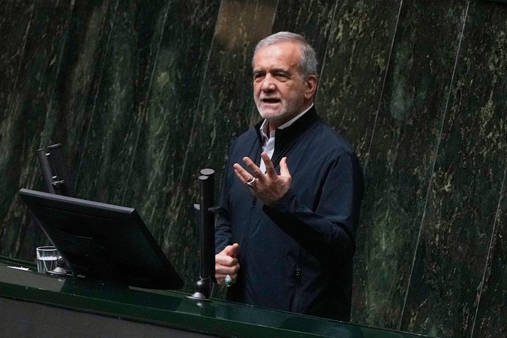 Iranian President Masoud Pezeshkian speaks during a memorial at the parliament in Tehran, Iran, Wednesday, May 21, 2025 (AP)