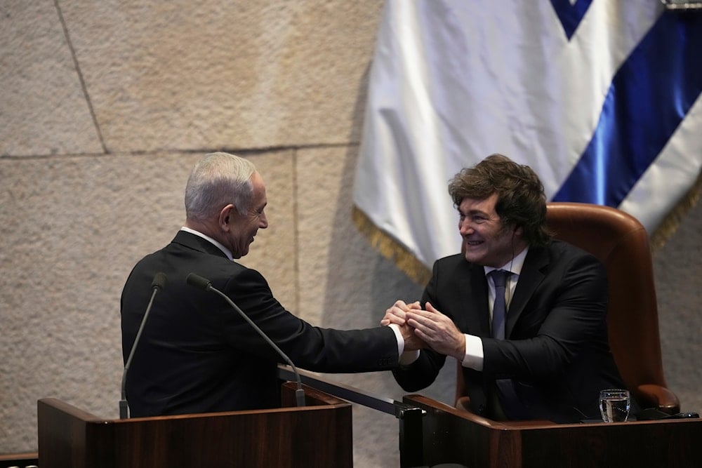  Israeli Prime Minister Benjamin Netanyahu, greets Argentina's President Javier Milei in the Israelه parliament, in al-Quds, Occupied Palestine, Wednesday, June 11, 2025 (AP)