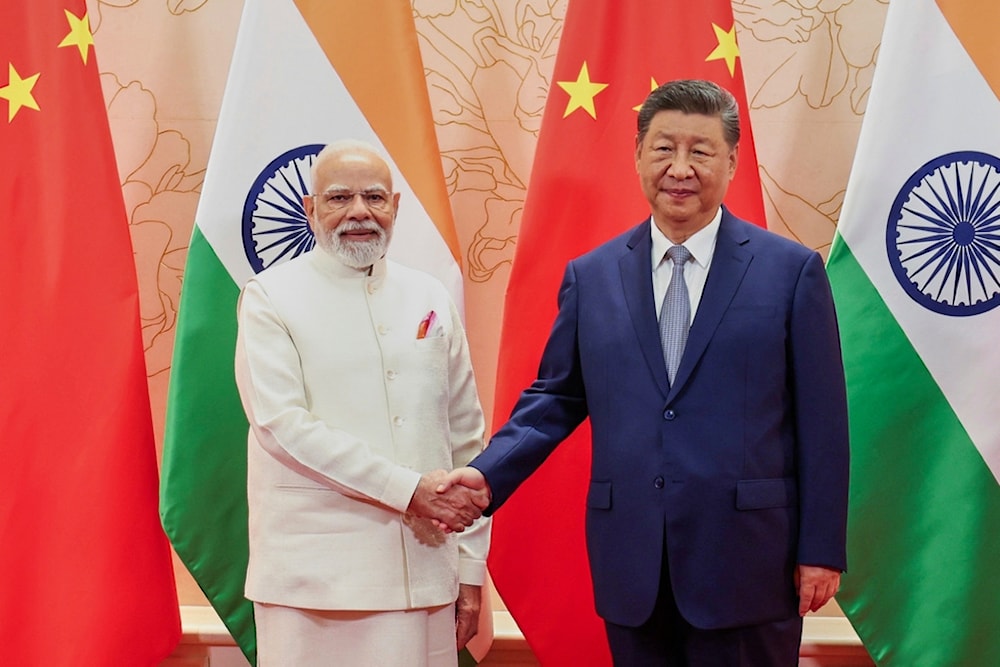 Indian Prime Minister Narendra Modi and Chinese President Xi Jinping shake hand before their meeting on the sidelines of the Shanghai Cooperation Organization (SCO) summit in Tianjin, China Sunday, August 31, 2025. (Indian Prime Minister's Office via AP)
