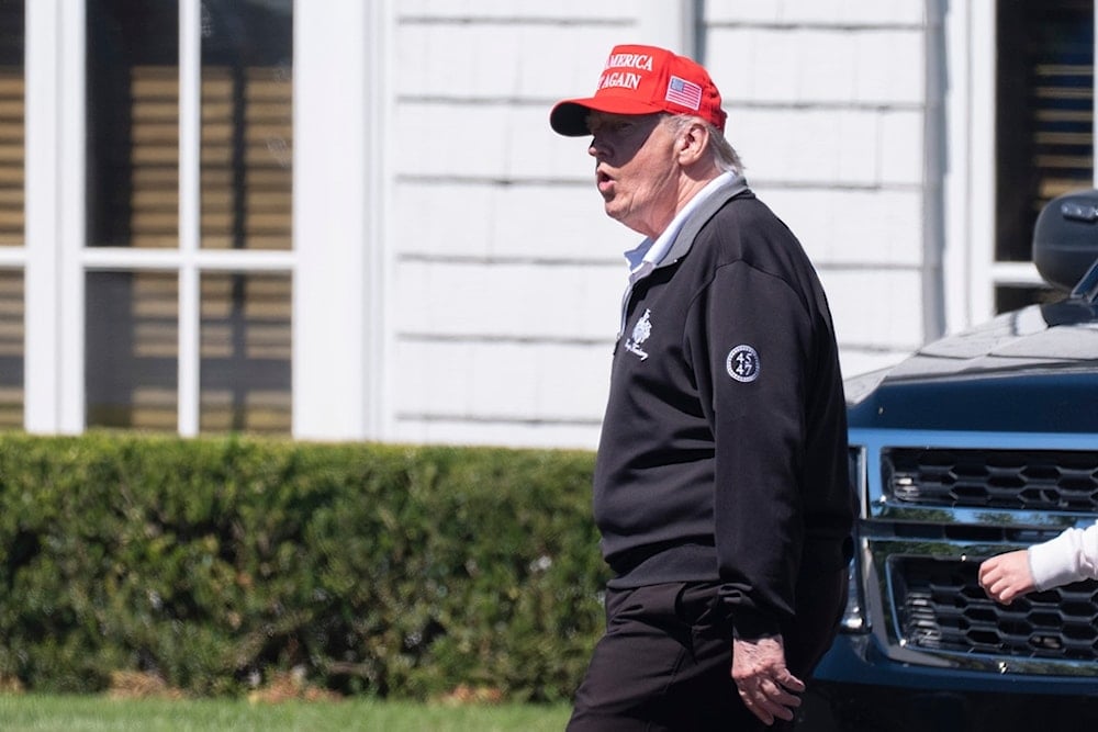 President Donald Trump walks at the Trump National Golf Club in Sterling, Va., Saturday, August 30, 2025 (AP)
