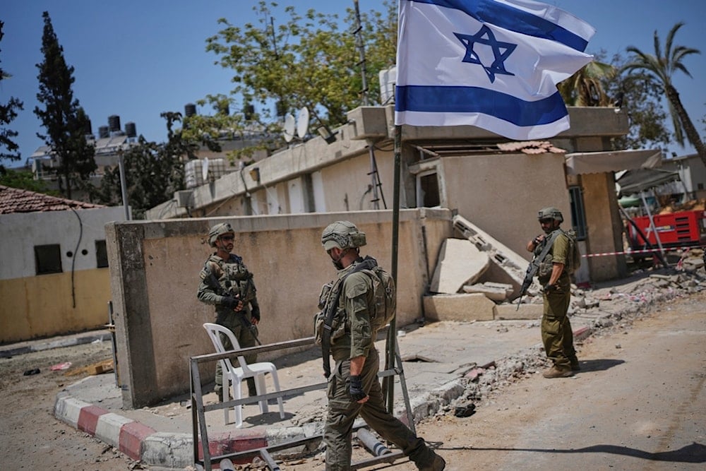 Israeli soldiers take up position at the European Hospital in Khan Younis, southern Gaza, on Sunday, June 8, 2025. (AP Photo/Ohad Zwigenberg)