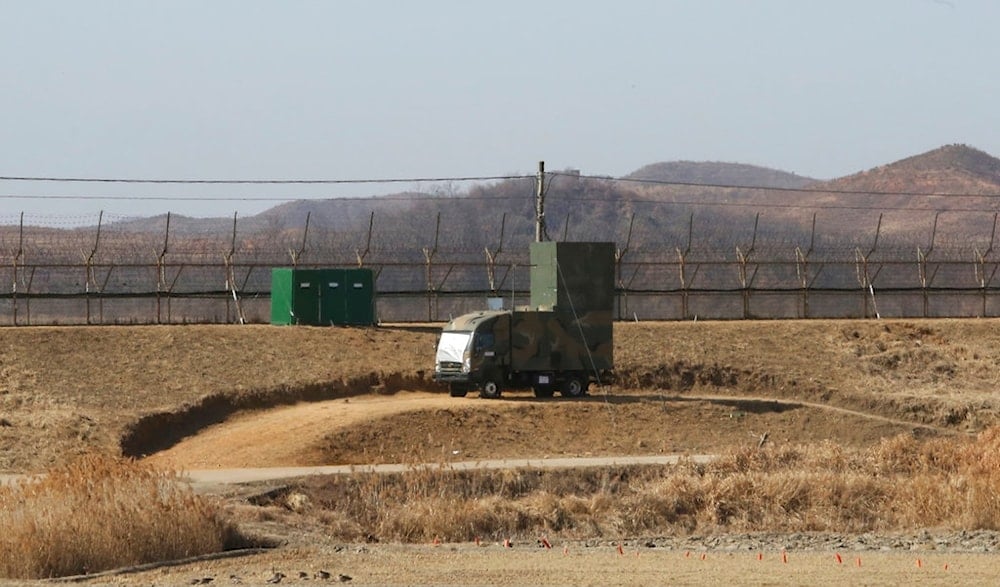 In this Feb. 15, 2018 photo, a South Korean military vehicle with loudspeakers is seen in front of the barbed-wire fence in Paju, near the border with the Democratic People's Republic of KoreaAP)
