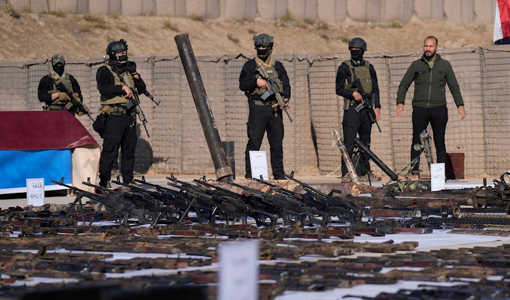 The Popular Mobilization Forces (PMF) display weapons seized from ISIS in Salahuddin province, north of Baghdad, Iraq, Thursday, Jan 12, 2023. (AP)