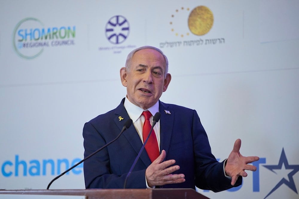Israeli Prime Minister Benjamin Netanyahu speaks to the audience at a conference in occupied al-Quds, occupied Palestine, Sunday, July 27, 2025 (AP)