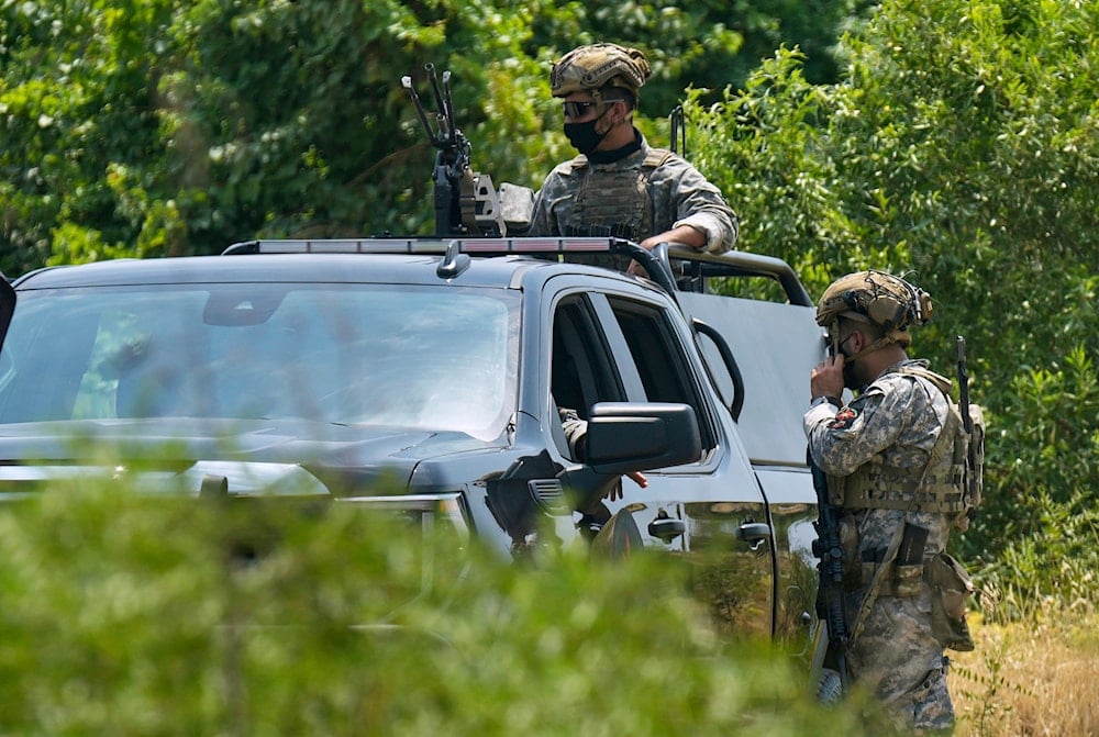 Forces of the regional Kurdish administration secure the area of the Jasana Cave ahead of a symbolic disarmament ceremony by the PKK as part of the peace process with Turkey, in Sulaymaniyah governorate, Iraq, Friday, July 11, 2025 (AP)
