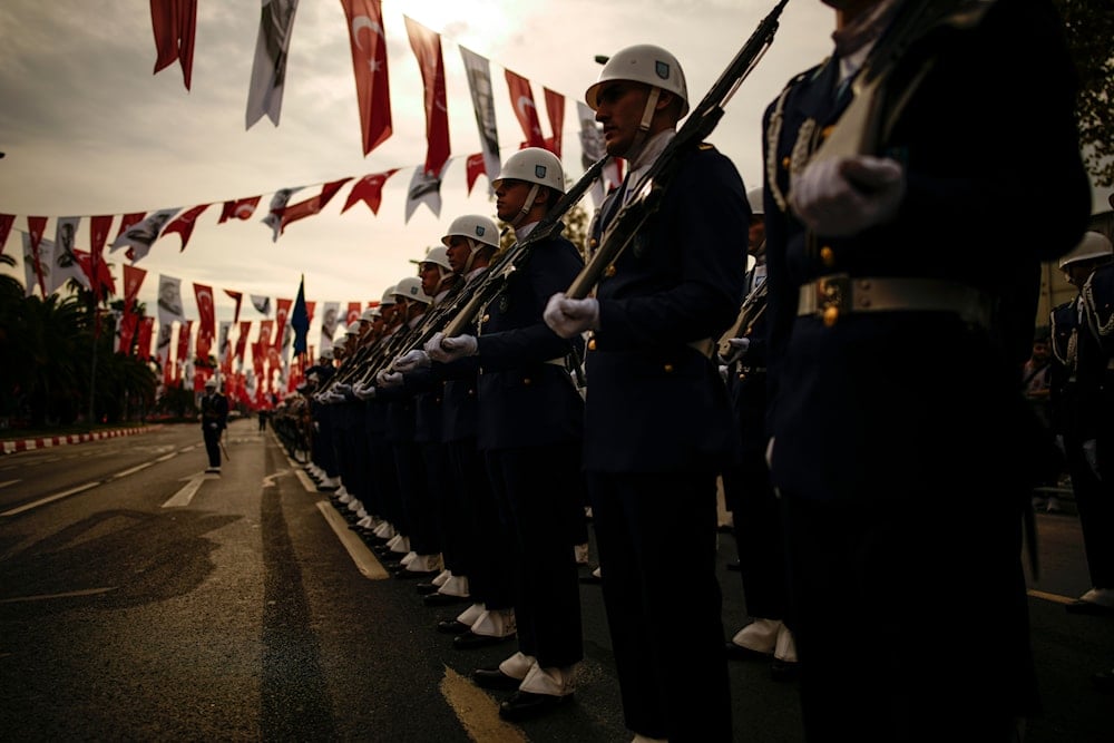 Turkey's army soldiers parade as part of celebrations marking the 100th anniversary of the creation of the modern, secular Turkish Republic, in Istanbul, Turkey, Sunday, Oct. 29, 2023 (AP)