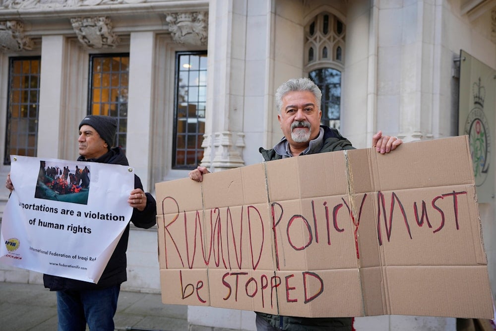 Protesters stand outside the Supreme Court in London, on November 15, 2023. (AP)