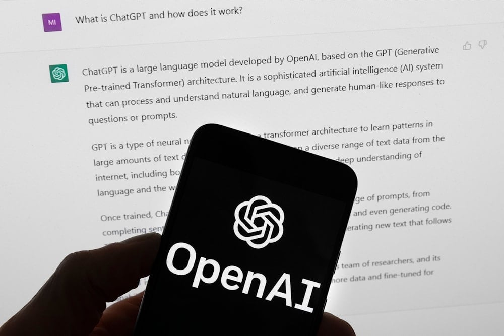 he OpenAI logo is seen on a mobile phone in front of a computer screen which displays output from ChatGPT, on March 21, 2023, in Boston. (AP Photo/Michael Dwyer, File)