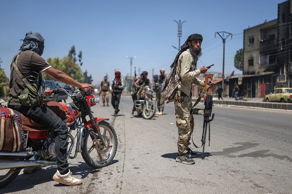 Bedouin fighters deploy at Mazraa village on the outskirts of Sweida city, during clashes between the Bedouin clans and Druze militias, southern Syria, Friday, July 18, 2025. (AP)
