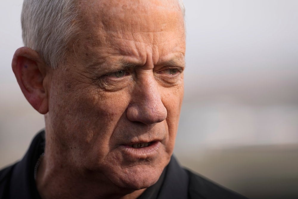 Israeli politician Benny Gantz speaks with the media on a viewpoint near the so-called Alpha Line that separates the Israeli-annexed Golan Heights from Syria, Sunday, Dec. 8, 2024 (AP)