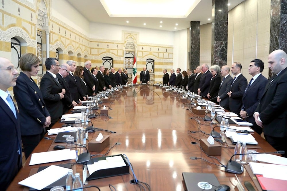 Lebanese President Joseph Aoun, center background, Prime Minister Nawaf Salam, left background, and ministers of the new government at the presidential palace, in Baabda, east of Beirut, Lebanon, Tuesday, Feb. 11, 2025 (AP)