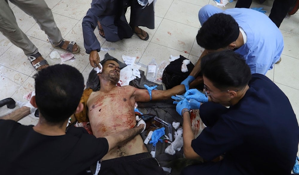 A Palestinian wounded while returning from one of the Gaza Humanitarian Foundation distribution centers is treated in Khan Younis, Monday, June 30, 2025. (AP)