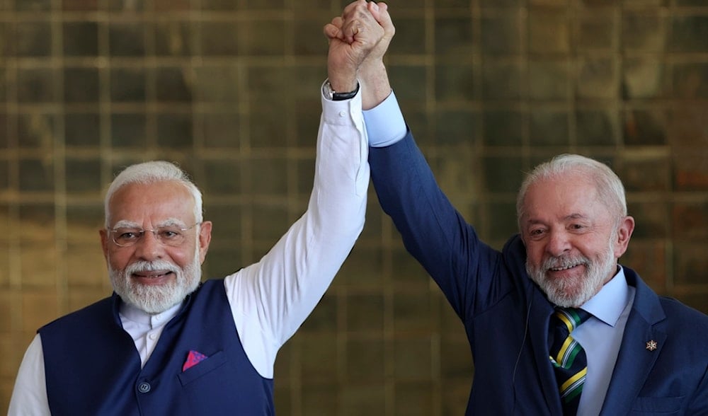 India's Prime Minister Narendra Modi, left, and Brazil's President Luiz Inacio Lula da Silva hold up their hands during a meeting at Alvorada Palace in Brasilia, Brazil, Tuesday, July 8, 2025. (AP)