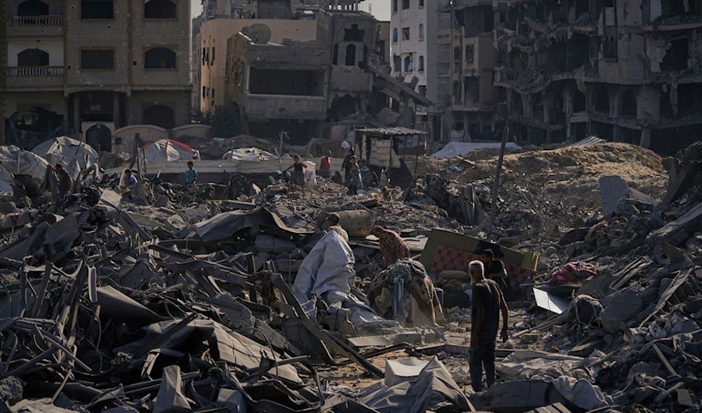 People inspect the damage at the Sheikh Radwan al-Taba UNRWA clinic following an Israeli bombardment in Gaza City Wednesday, Aug. 6, 2025. (AP)
