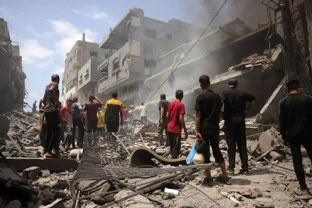 Palestinians inspect the destruction after an airstrike on the Al-Zaytoun neighborhood in southern Gaza City , August 8, 2025. (AFP)