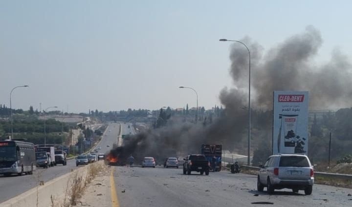 Smoke billows after an Israeli drone strike targeted a vehicle on Ansariyeh road, South Lebanon, killing one person, August 8, 2025 (Social Media)