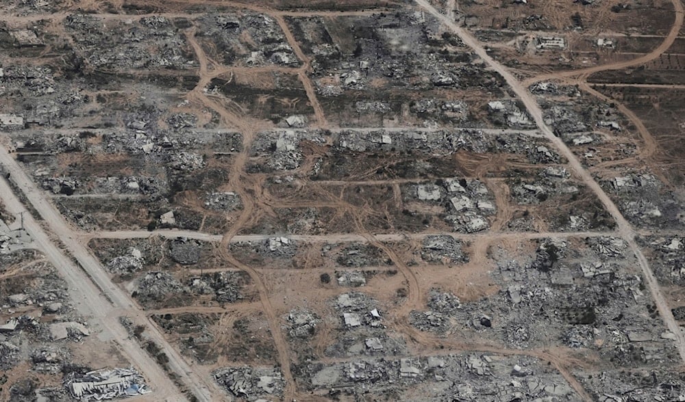 Destroyed buildings in the Gaza Strip are seen from a Jordanian Air Force C-130 plane during an airdrop of humanitarian aid for Palestinians, Thursday, Aug. 7, 2025. (AP)