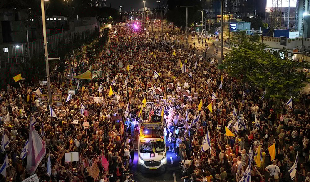 Relatives and supporters of Israeli captives held in the Gaza Strip attend a rally demanding their release and calling for an end to the war, in Tel Aviv, occupied Palestine, Saturday, Aug. 9, 2025. (AP)