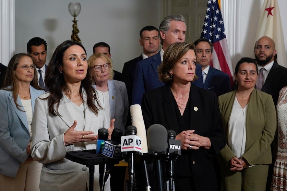 Texas House of Representatives members Gina Hinojosa and Ann Johnson, two of the state lawmakers that have left the Texas to block a vote to redraw the voting districts, speak at a news conference in Sacramento, California, Friday August, 8 2025 (AP)