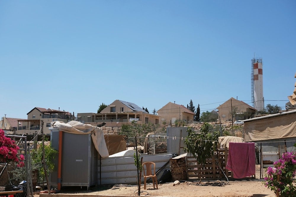 The Israeli settlement of Carmel is visible on Monday, August 4, 2025, from the Palestinian hamlet of Umm al-Khair, West Bank (AP)
