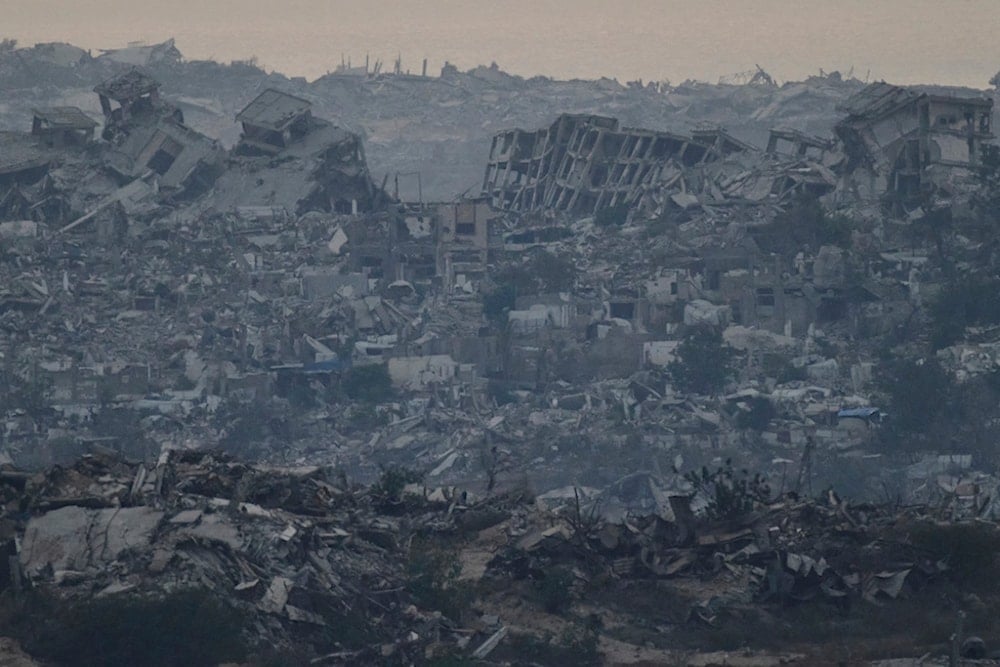 Buildings that were destroyed during the Israeli ground and air operations stand in the northern Gaza Strip as seen from southern occupied Palestine, Friday, August 8, 2025 (AP)  