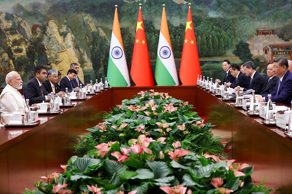 Indian Prime Minister Narendra Modi, left, and Chinese President Xi Jinping, right, hold a meeting on the sidelines of the SCO summit in Tianjin, China, Sunday, August 31, 2025. (Indian Prime Minister's Office via AP)