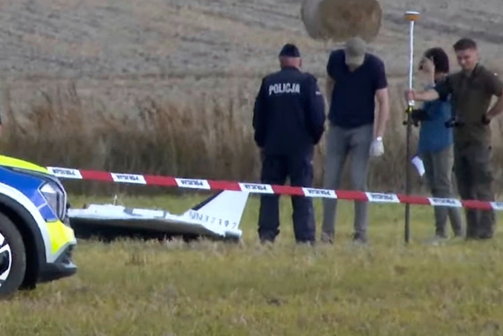 In this image made from video, Police and Military Police secure parts of a damaged object shot down by Polish authorities at a site in Wohyn, Poland, Wednesday, Sept. 10, 2025 (AP)