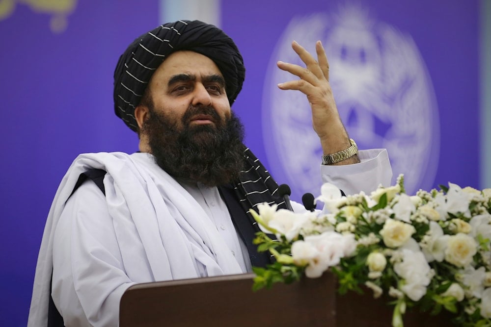 Taliban's Foreign Minister Amir Khan Muttaqi, addresses delegates during a meeting marking the fourth anniversary of the US withdrawal and the start of Taliban rule, at Loya Jirga Hall in Kabul, Friday, Aug. 15, 2025 (AP)