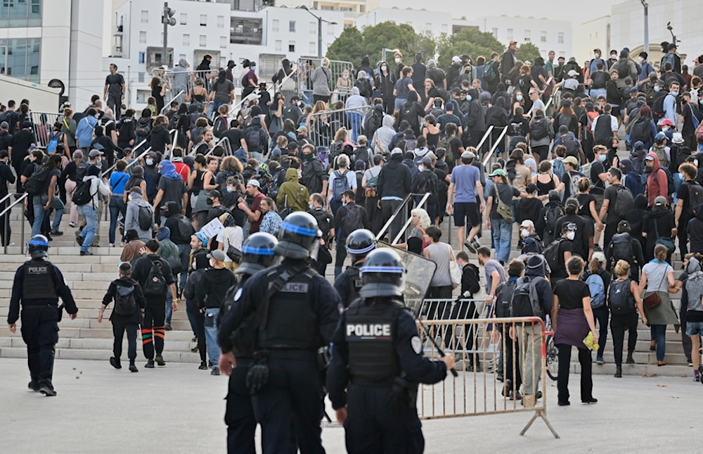 French police disperse protesters during a gathering of the 