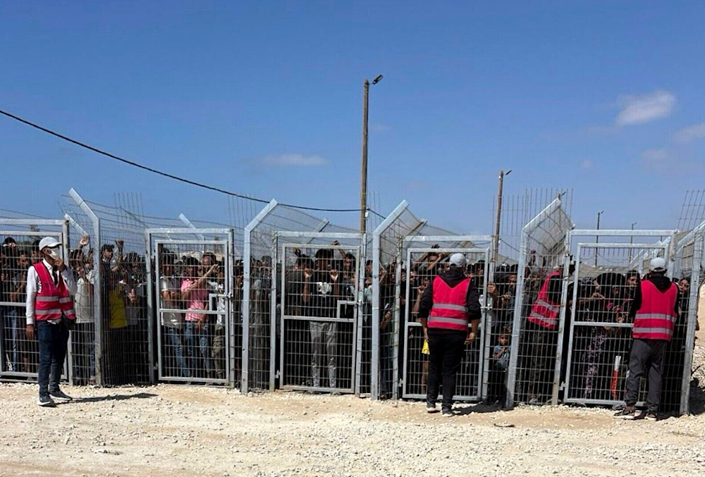 A photo provided by an American contractor shows Palestinians behind gates before entering a food distribution site operated by the Gaza Humanitarian Foundation in May 2025. (AP)