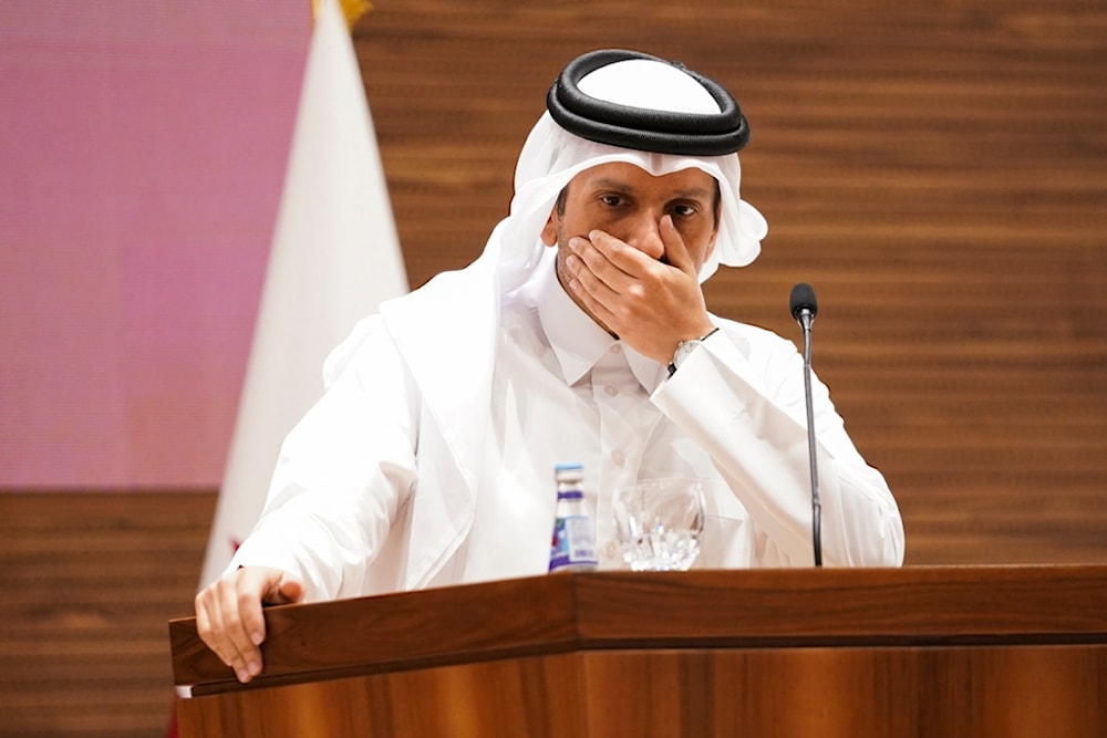 Qatari Prime Minister and Foreign Minister Mohammed bin Abdulrahman Al Thani gestures as he attends a press conference in Doha, Qatar, Thursday, October 24, 2024. (Nathan Howard/Pool Photo via AP)