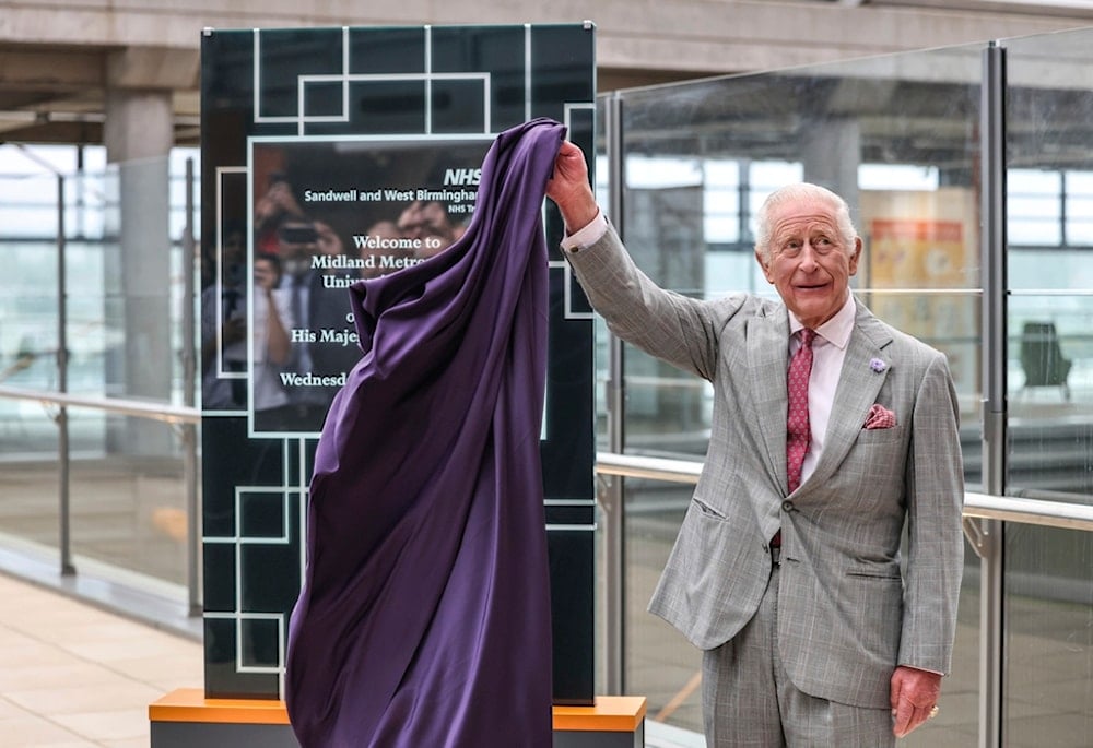 Britain's King Charles unveils a plaque as he officially opens the Midland Metropolitan University Hospital, in Smethwick, England, Wednesday September 3, 2025. (Richard Pohle/The Times/Pool via AP)