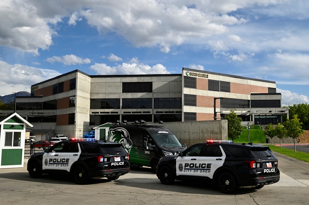 Law enforcement vehicles surround buildings at Utah Valley University on Wednesday, September 10, 2025, in Orem, Utah. (AP Photo/Alex Goodlett)