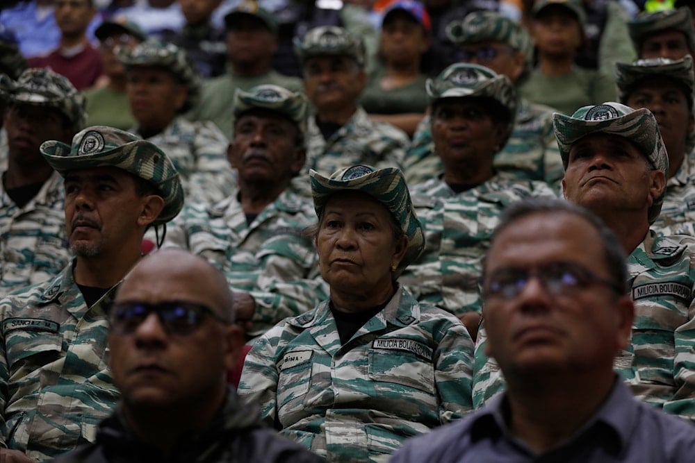 Members of the Bolivarian Militia listen to a recorded speech by President Nicolás Maduro at a military garrison in Caracas, Venezuela, Friday, Sept. 5, 2025 (AP)